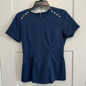 Original Jaanuu Scrub top with gold zipper detail.